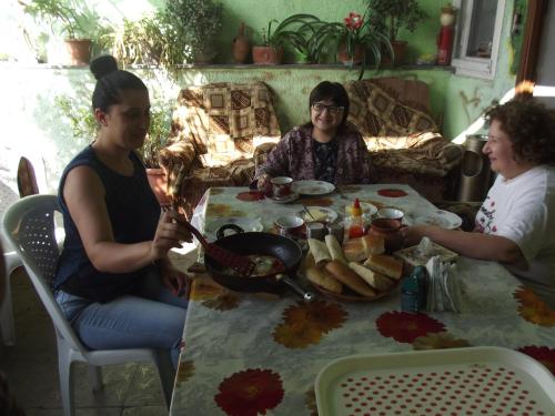 a group of women sitting around a table eating food at Lovely Goris in Goris