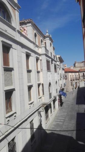 a large white building on a city street at VuT Dalia in Avila
