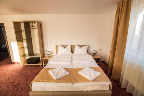 Katil atau katil-katil dalam bilik di Simar Bed & Coffee Guesthouse