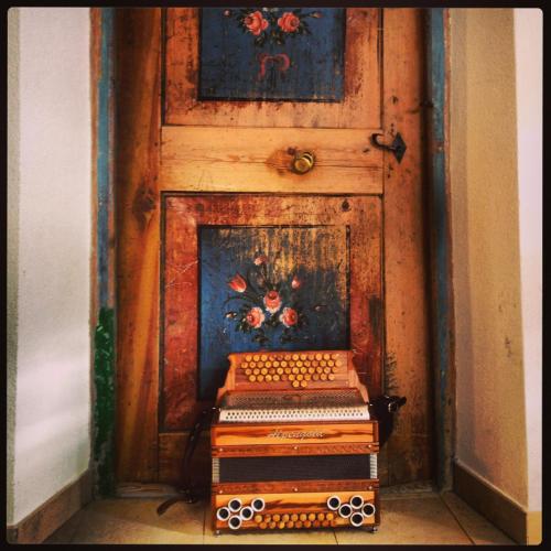 a stack of books sitting in front of a door at Ferienhaus Staudacher in Brennero