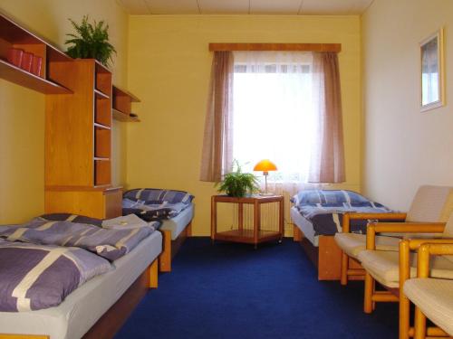 Postel nebo postele na pokoji v ubytování Hotel Na Trojce