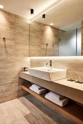 a bathroom with a sink and a mirror at Ibis Styles Heraklion Central in Heraklio Town
