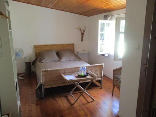 Postel nebo postele na pokoji v ubytování Bienvenue dans notre petit paradis