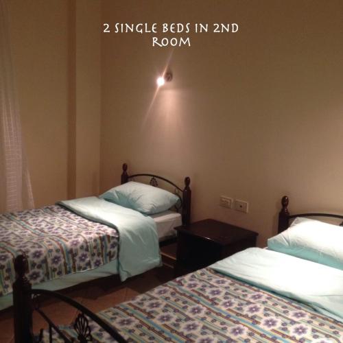 a room with two beds in a room at Apartment at Palm Beach Piazza in Hurghada