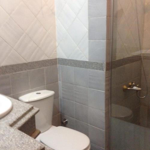 a bathroom with a toilet and a shower at Apartment at Palm Beach Piazza in Hurghada