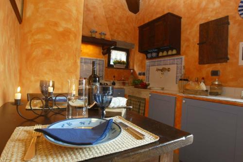 a kitchen with a table with a plate on it at Agriturismo Borgo La Casetta in San Baronto