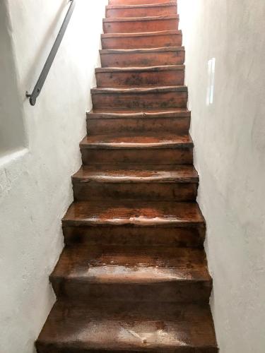 an old rusted staircase in a building at Hotel Kocour in Třebíč