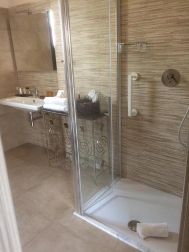 a bathroom with a shower and a sink at RIAD Comfort Rooms in San Vito lo Capo