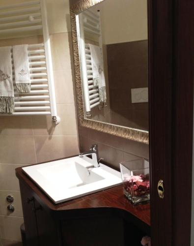 a bathroom with a sink and a mirror at Cherry House Bed&Breakfast in Campobasso