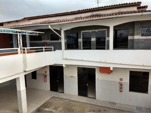 an external view of a building with doors and windows at Flats Temporada & Mensal in Aracaju