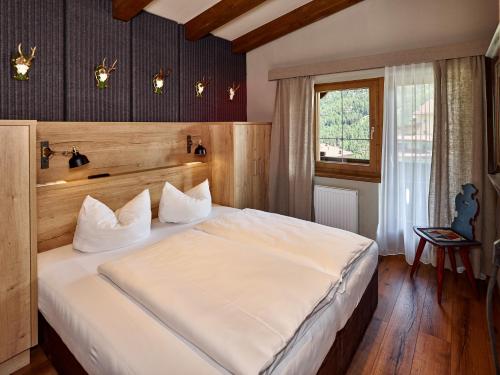 A bed or beds in a room at A Casa Juwel Apartment