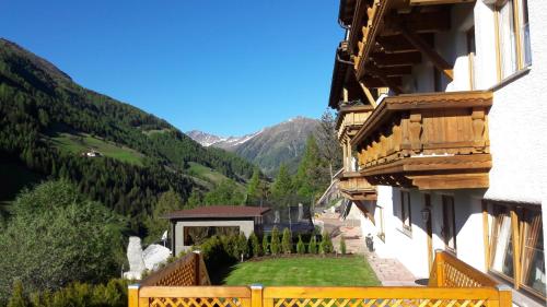 a balcony of a building with a view of a mountain at Ferienwohnung Plattner in Schmirn