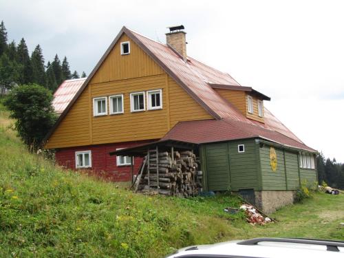 a large house on top of a hill at Horská Chata U Básníka in Horní Malá Úpa