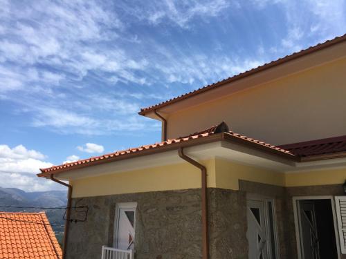 a view of a house with a roof at Casinha Minhota in Eirado