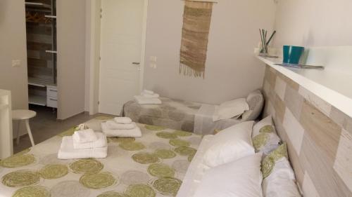 Postel nebo postele na pokoji v ubytování B&B Le Thuje