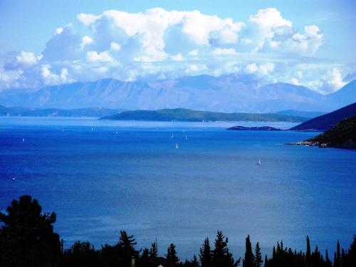 a large body of water with boats in it at Vila Tselentata in Fiskardho