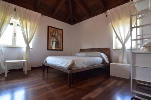 Posteľ alebo postele v izbe v ubytovaní AgrIGINO Villa Riccardi