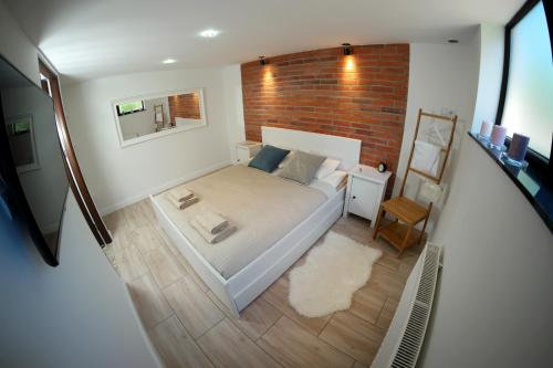 מיטה או מיטות בחדר ב-Sea Apartment 150m do morza