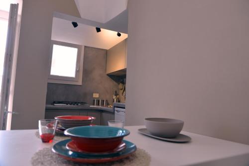 a kitchen with three bowls on a counter at Dammuso SOLMAR in Pantelleria