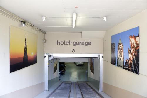 a hallway with a hotel garage sign on the wall at Park Hotel Post in Freiburg im Breisgau