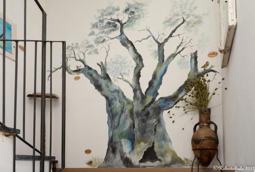 a painting of a tree on a wall at Agriturismo Monaci Templari in Seborga