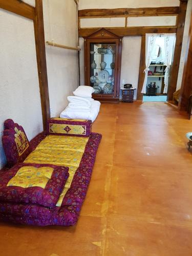 a room with two beds in a room at The Hanok in Jeonju
