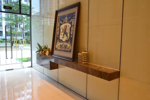 a painting on a wall in a hallway at Yumi Apartment Lida Plaza Branch in Guangzhou