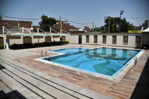 a swimming pool on top of a building at Hotel Sepal in Bathinda