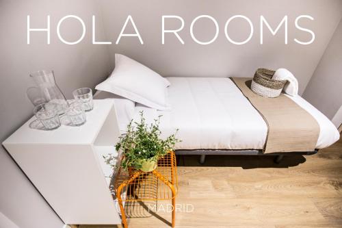 Ένα ή περισσότερα κρεβάτια σε δωμάτιο στο Hola Rooms