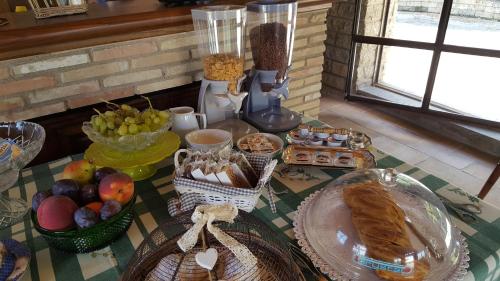 a table topped with baskets of bread and other food at Aquilamaior in Tragliata