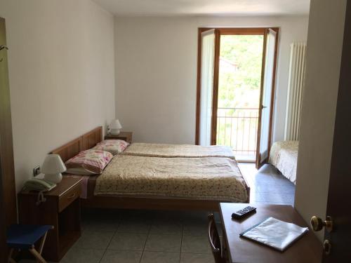 Postel nebo postele na pokoji v ubytování Hotel Cavaria