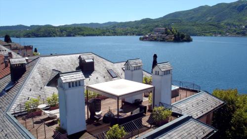 a house with a view of a lake at Hotel San Rocco in Orta San Giulio