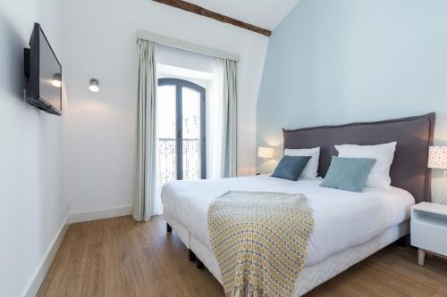 Ένα ή περισσότερα κρεβάτια σε δωμάτιο στο Florella Antibes Apartment