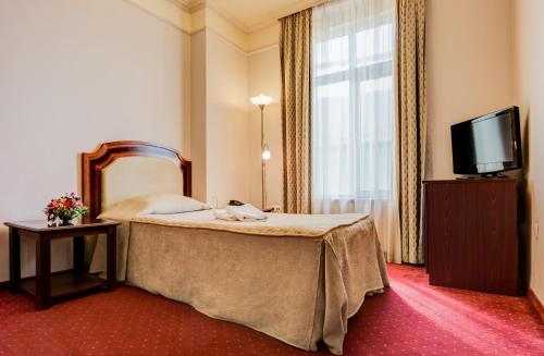 Un ou plusieurs lits dans un hébergement de l'établissement Boutique Splendid Hotel