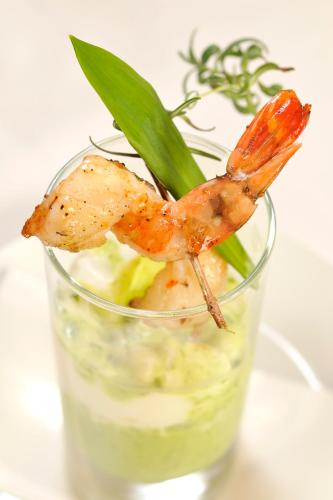 a glass with shrimp on top of a drink at Hotel Krone Langenegg in Langenegg