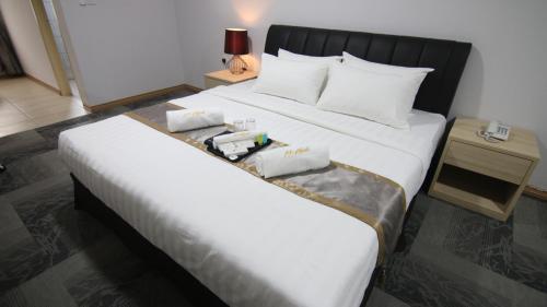 Ένα ή περισσότερα κρεβάτια σε δωμάτιο στο Al Afiah Hotel