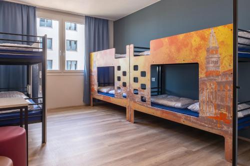 Postel nebo postele na pokoji v ubytování a&o Hostel Venezia Mestre