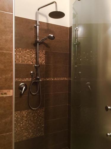 a bathroom with a shower with a glass door at B&B Maison Civico 13 in Ausonia