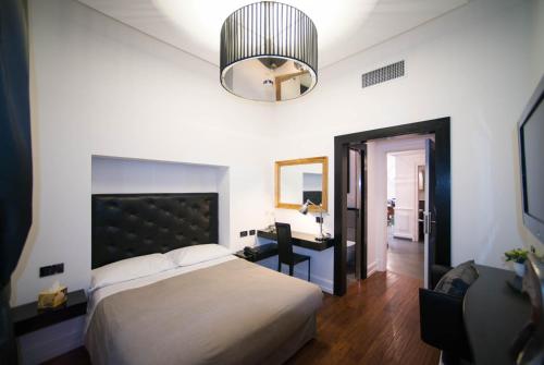En eller flere senger på et rom på Le Stanze Di Federica