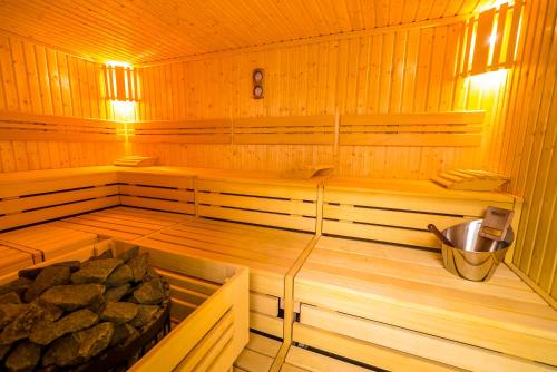 a inside of a sauna with a tub at All Suites Appart Hôtel - Choisy-le-Roi in Choisy-le-Roi
