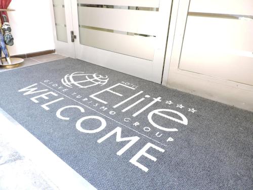 a welcome mat in front of a door at Hotel Elite Palermo Centro in Palermo