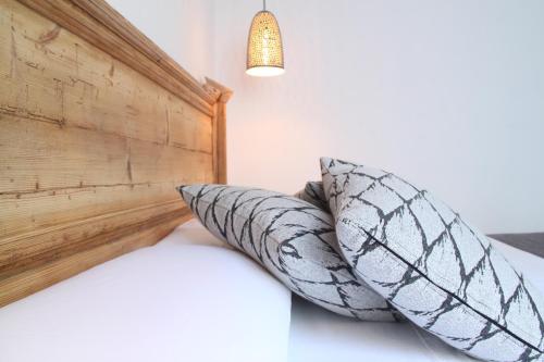 a bedroom with two pillows on a bed at S'Esparteria Hotel in Ciutadella