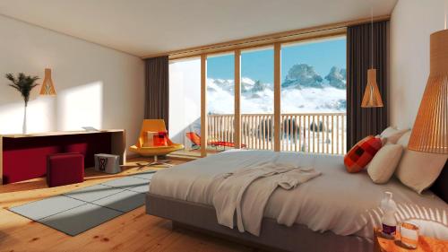 a bedroom with a large bed and a large window at Bestzeit Lifestyle & Sport Hotel in Parpan