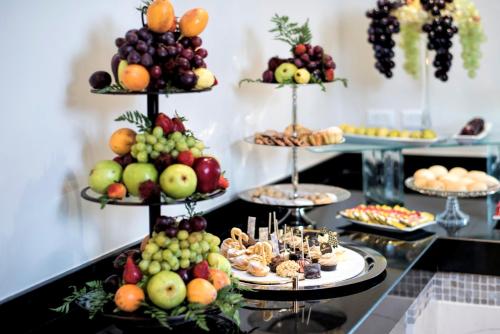 a display of different types of fruits and snacks at Iberostar Waves Tucan - All Inclusive in Playa del Carmen