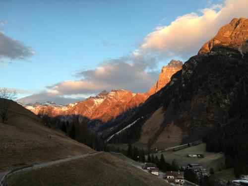 a view of a mountain with the sun shining on it at Ferienhaus Staudacher in Brennero