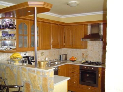 Kuchyň nebo kuchyňský kout v ubytování Janus Apartman