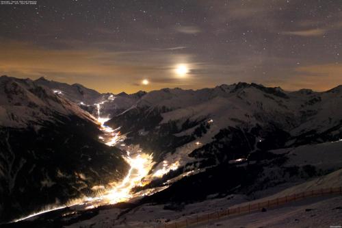 a view of a mountain at night with the moon at Pension Rosengarten in Tux