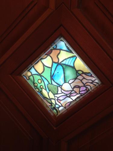 a stained glass window on the ceiling of a room at Villa Pedro in Szigliget
