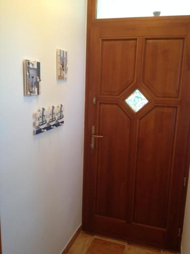 a wooden door in a room with a window at Villa Pedro in Szigliget