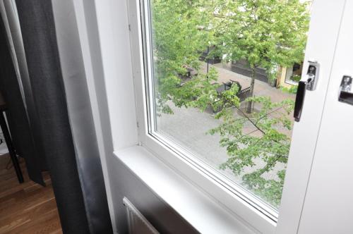 a window with a view of a street at City Hotel in Kristinehamn